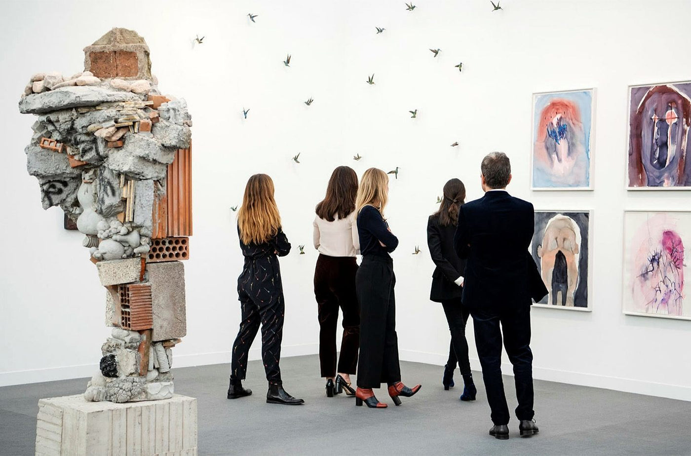 People at an art fair looking at art work