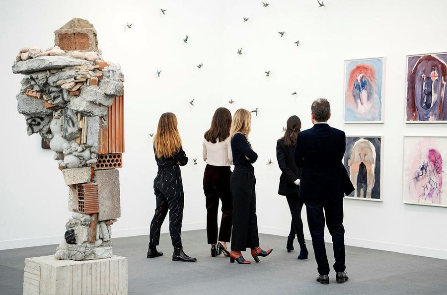 People at an art fair looking at art work