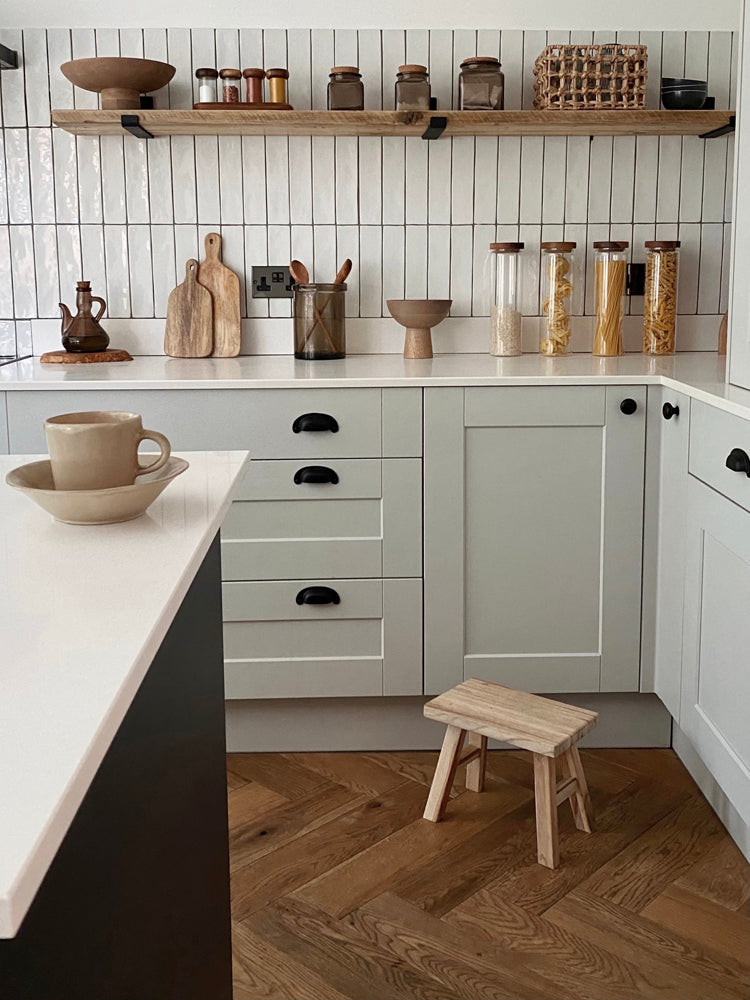 Minimalist kitchen with green cupboards